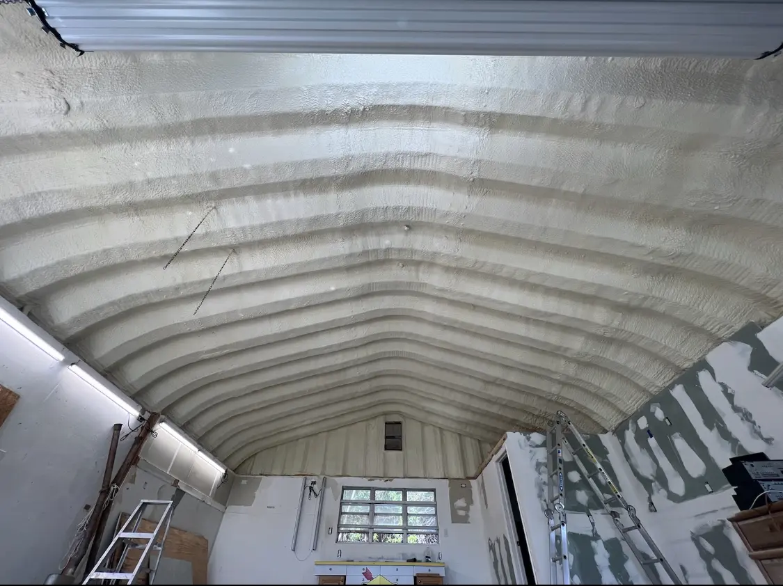 Spray polyurethane foam applied to the underside of a metal roof deck in Fredericksburg